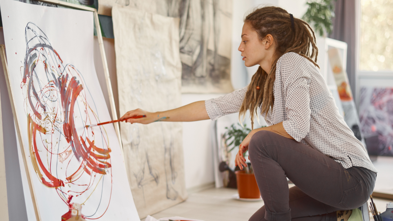 woman learning to paint with acrylic paintbrush painting tips