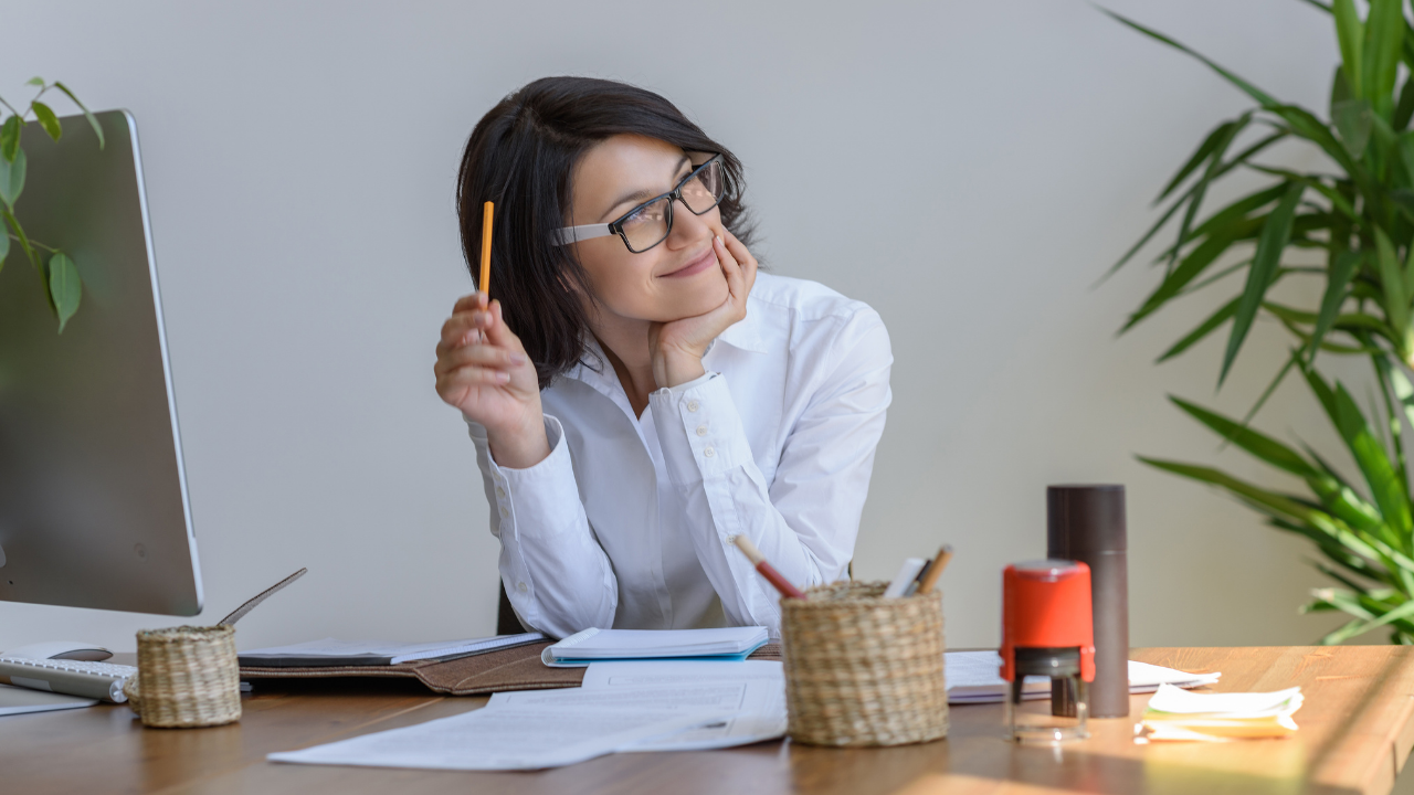 woman in office thinking, woman thinking