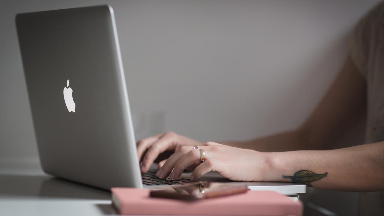 woman typing on laptop