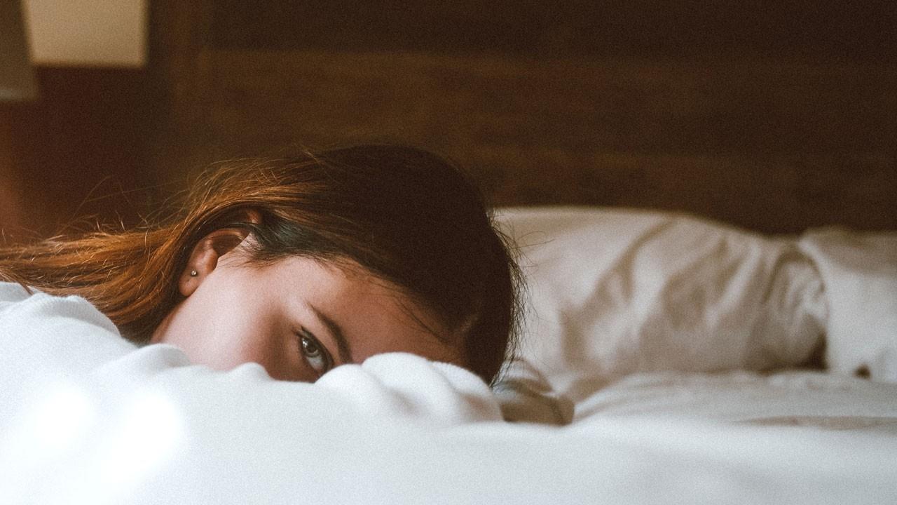 woman lying awake in bed