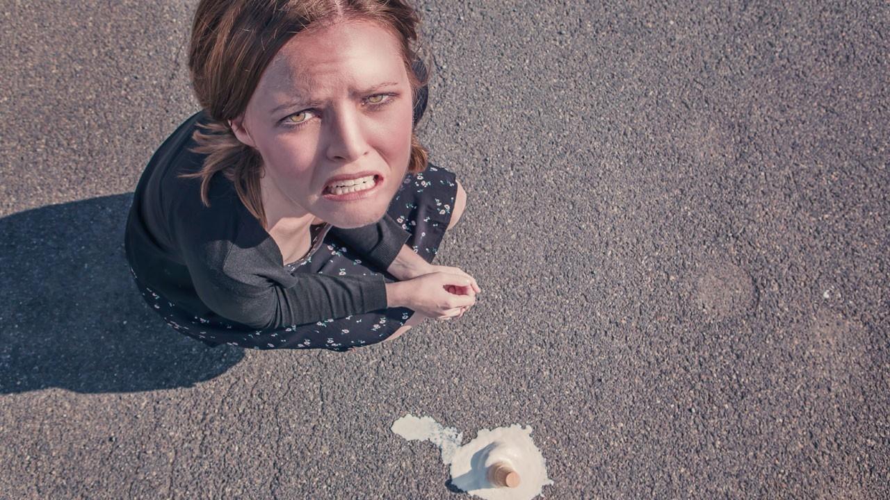 upset woman who dropped her ice cream