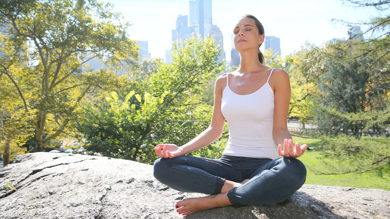 woman meditating in nature