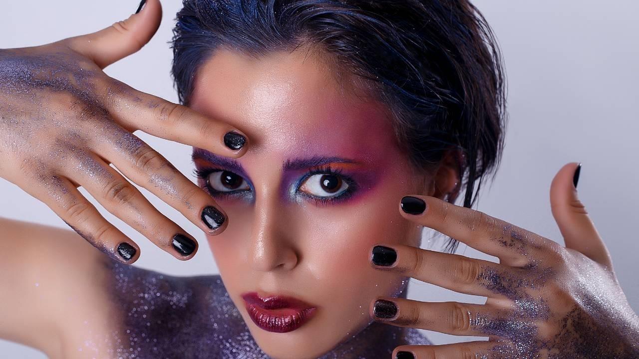Cosmic girl with hands to face to reveal herself - Get Out Of Your Comfort Zone...and Start Showing Up! - Leanne Juliette