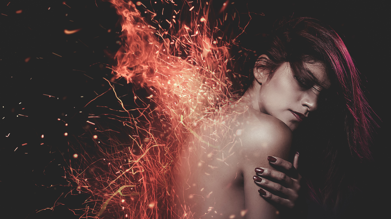 Image of a naked woman with her back on fire - forged in the fire - revolutionary transformation and spiritual awakening