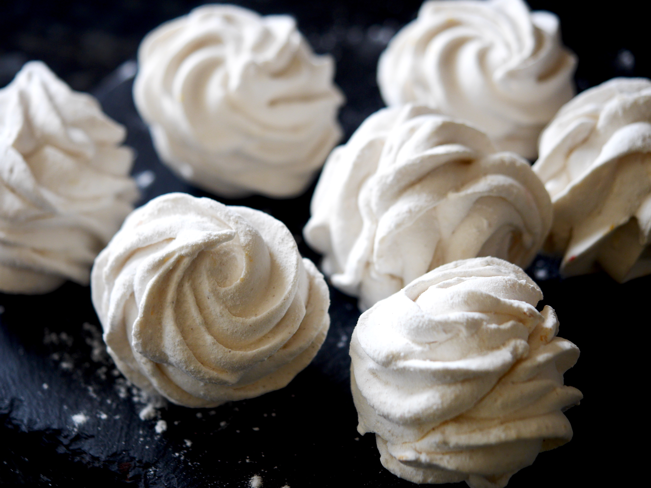 Piping zephyr meringue around caramel centres