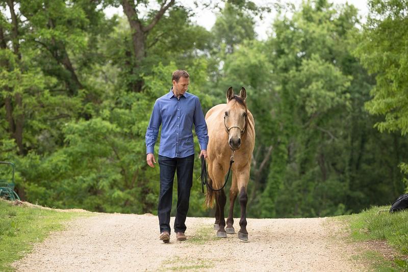 Horse Empowered programs. Shawn Carlin walking with his horse