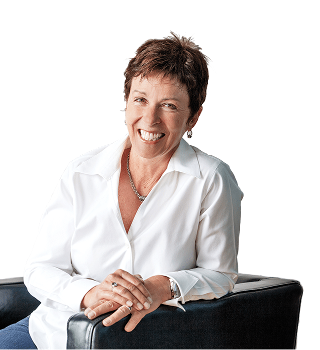 Laurie Hunt In White Shirt Sitting On Chair