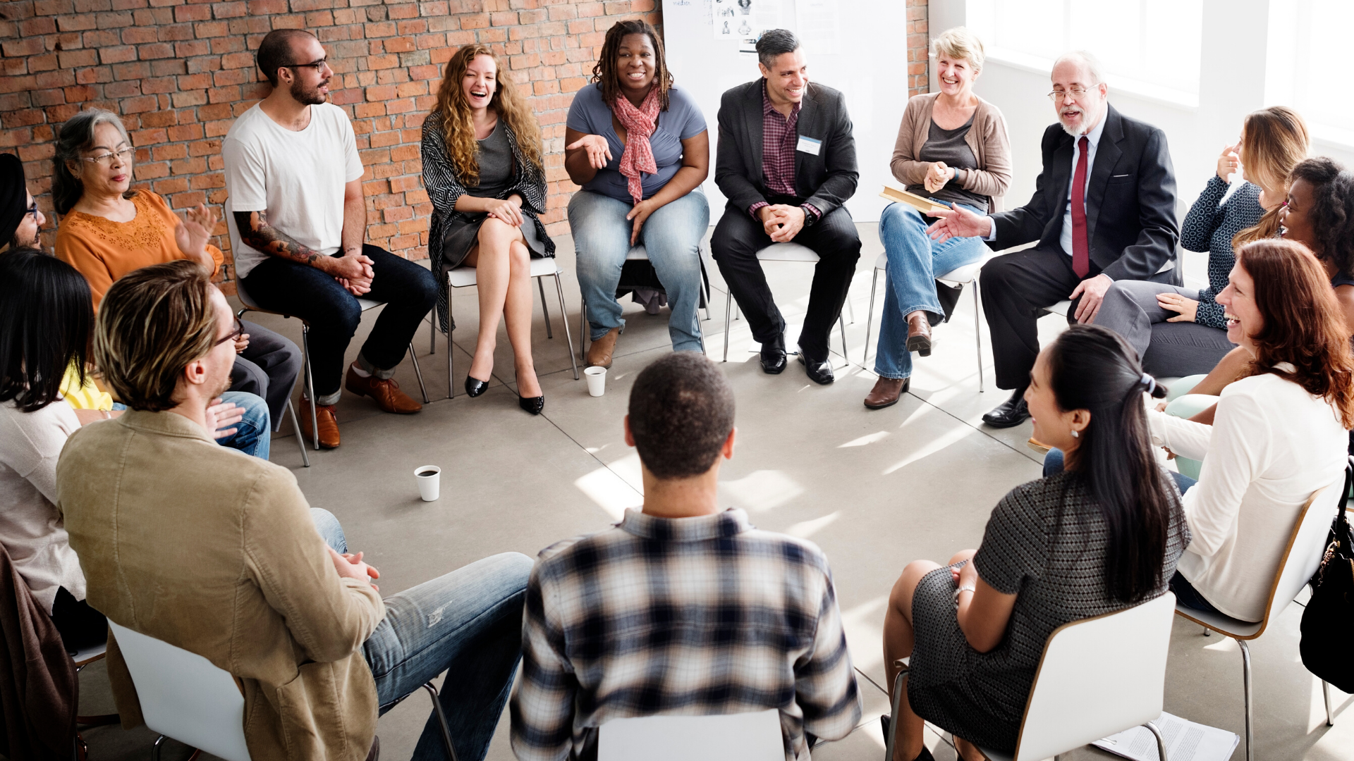 interactive team exercise of diverse people sitting in a circle