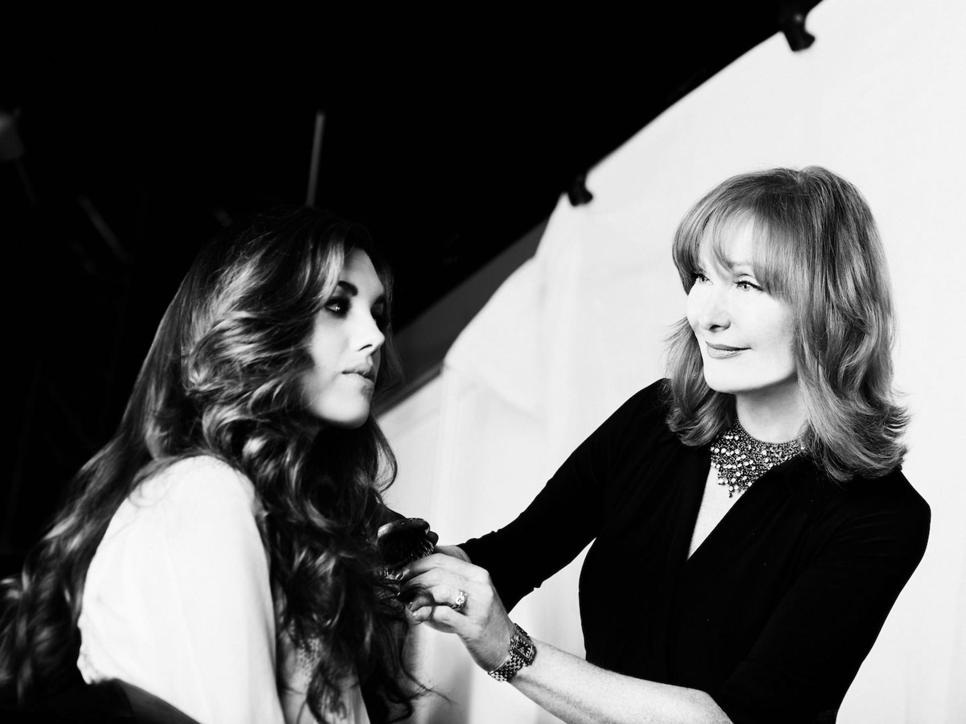 Vivienne Mackinder doing hair on model at photoshoot