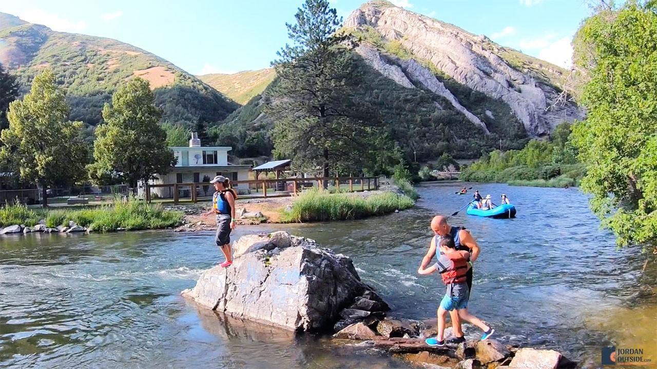 Walking over rocks on the Provo River