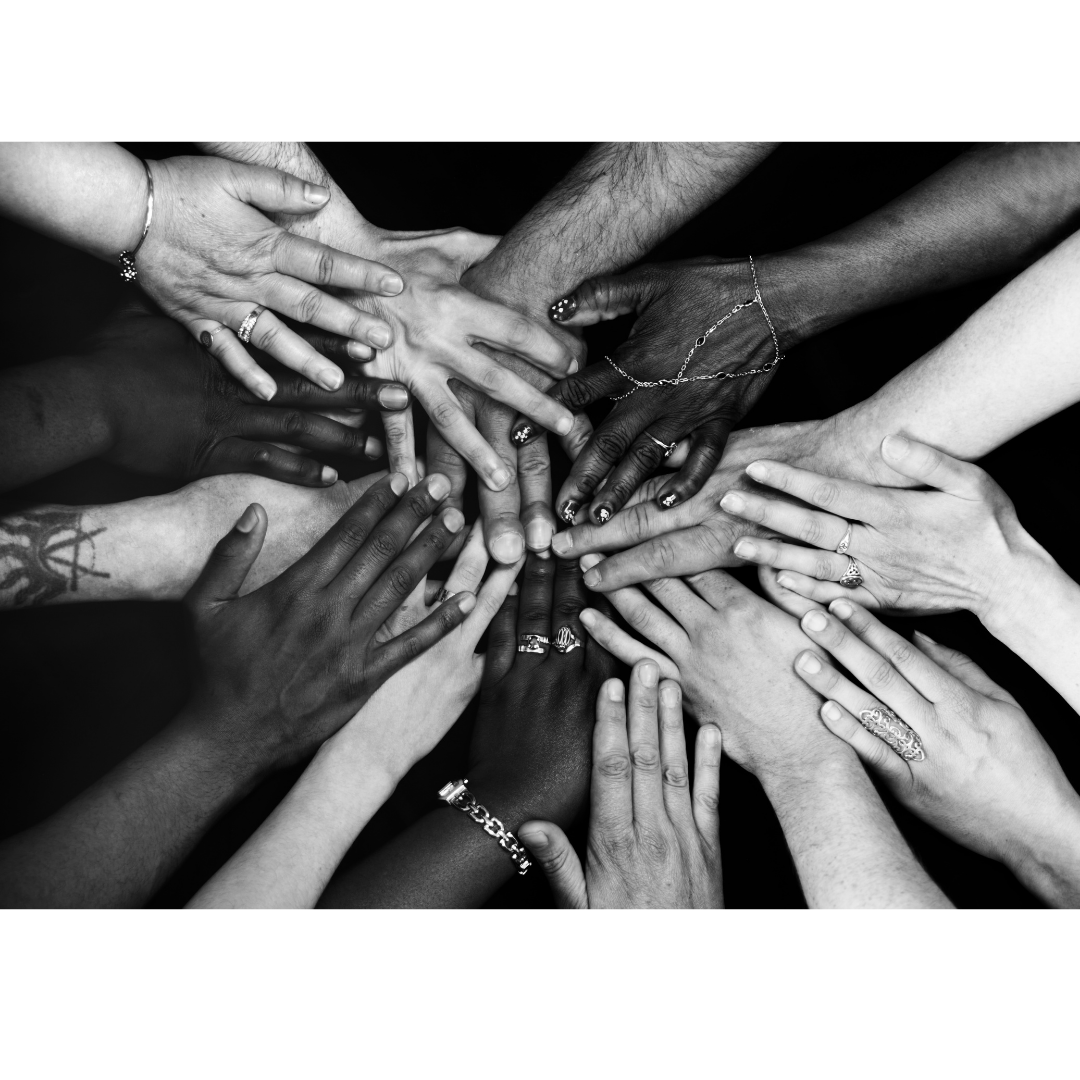 community of hands reaching together