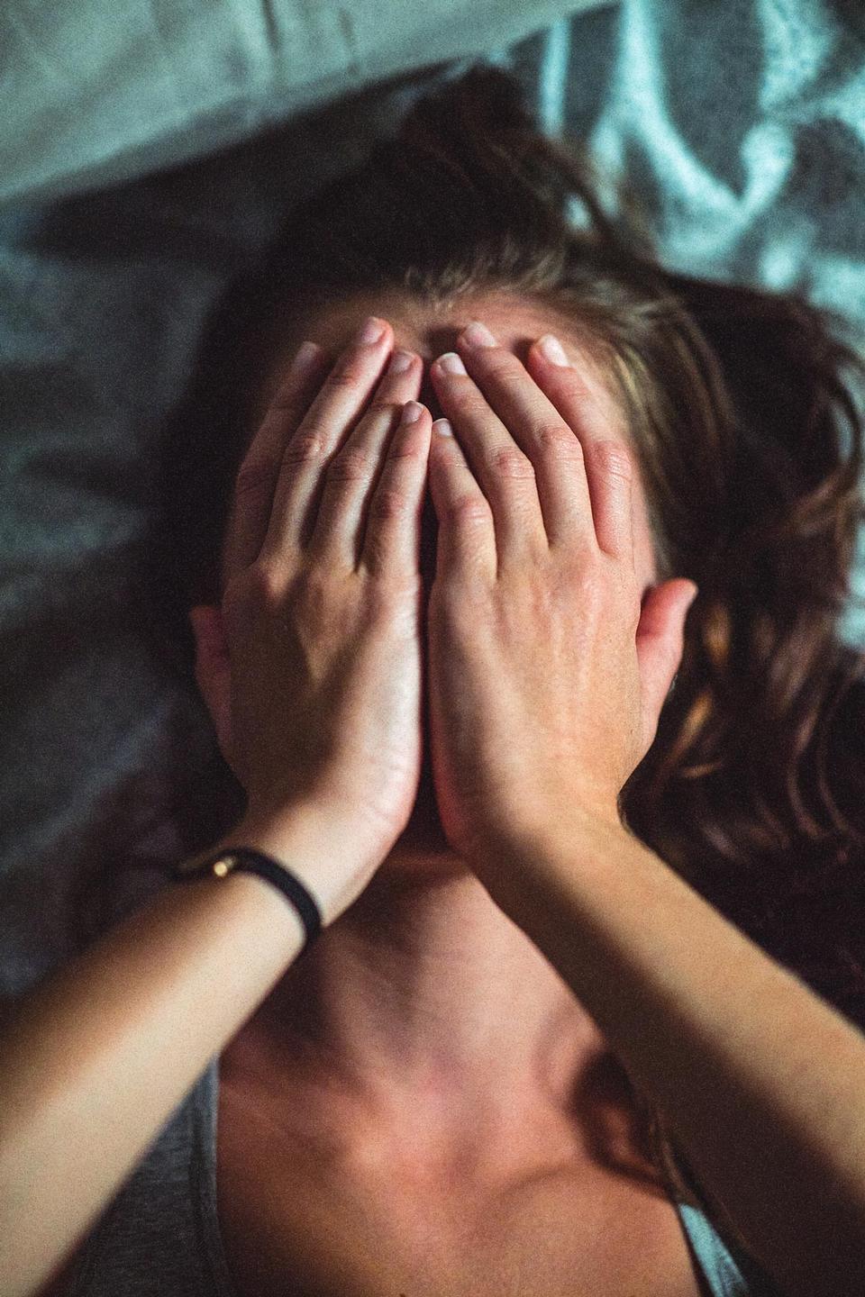 Woman covering face