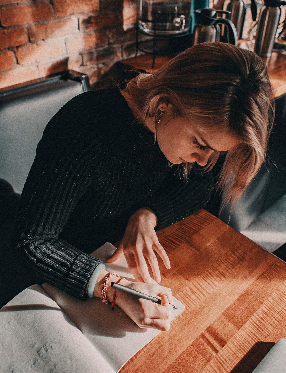 Woman writing a book