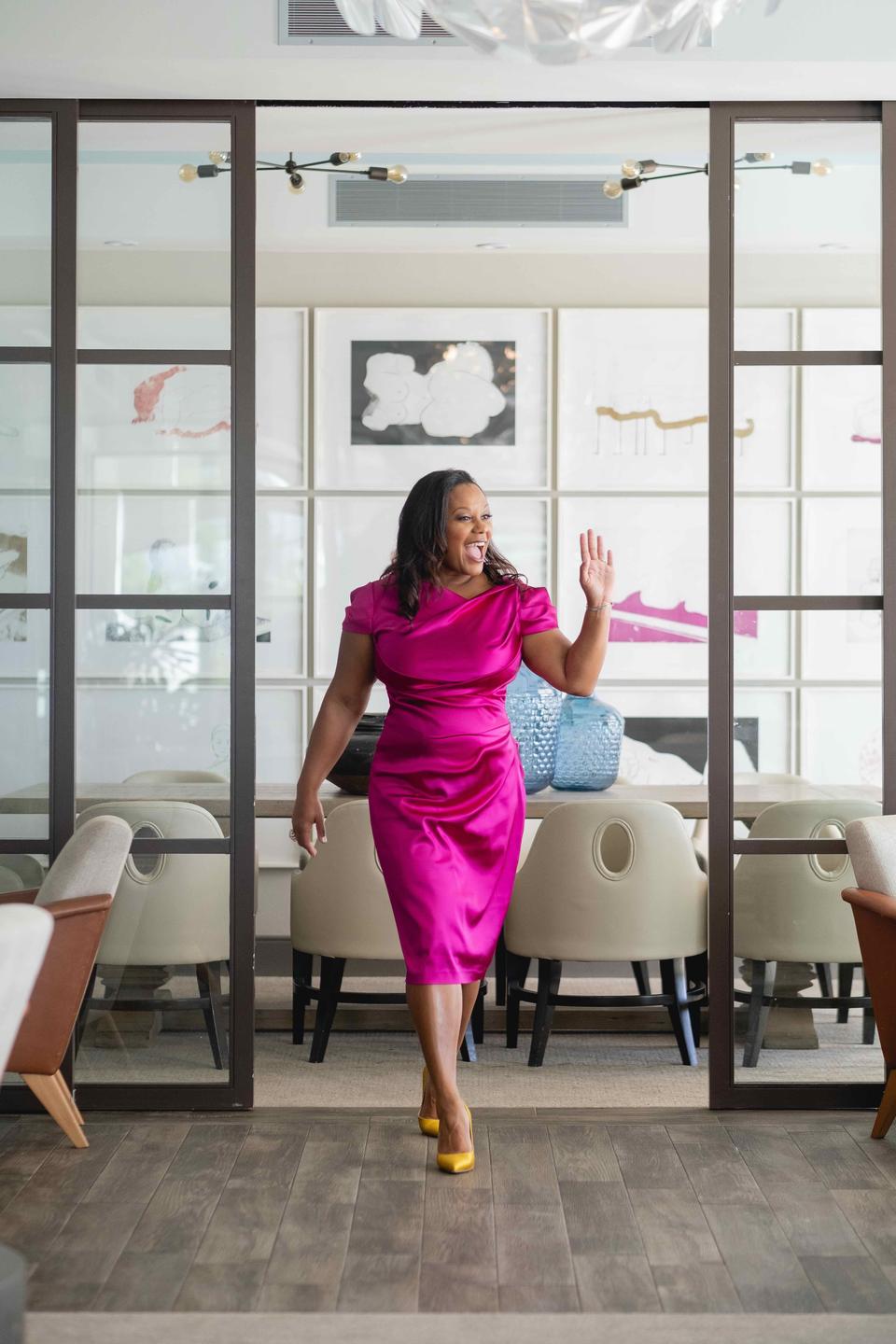 Leah JM Dean, author, pink dress walking
