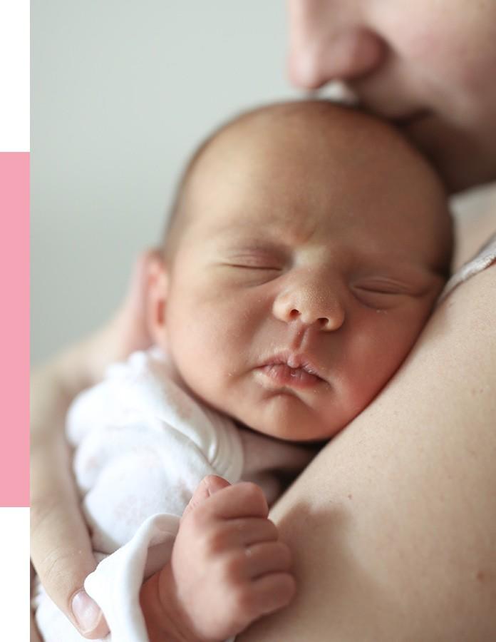 Baby Sleeping in Mothers Arms