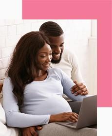 Pregnant Couple on Laptop