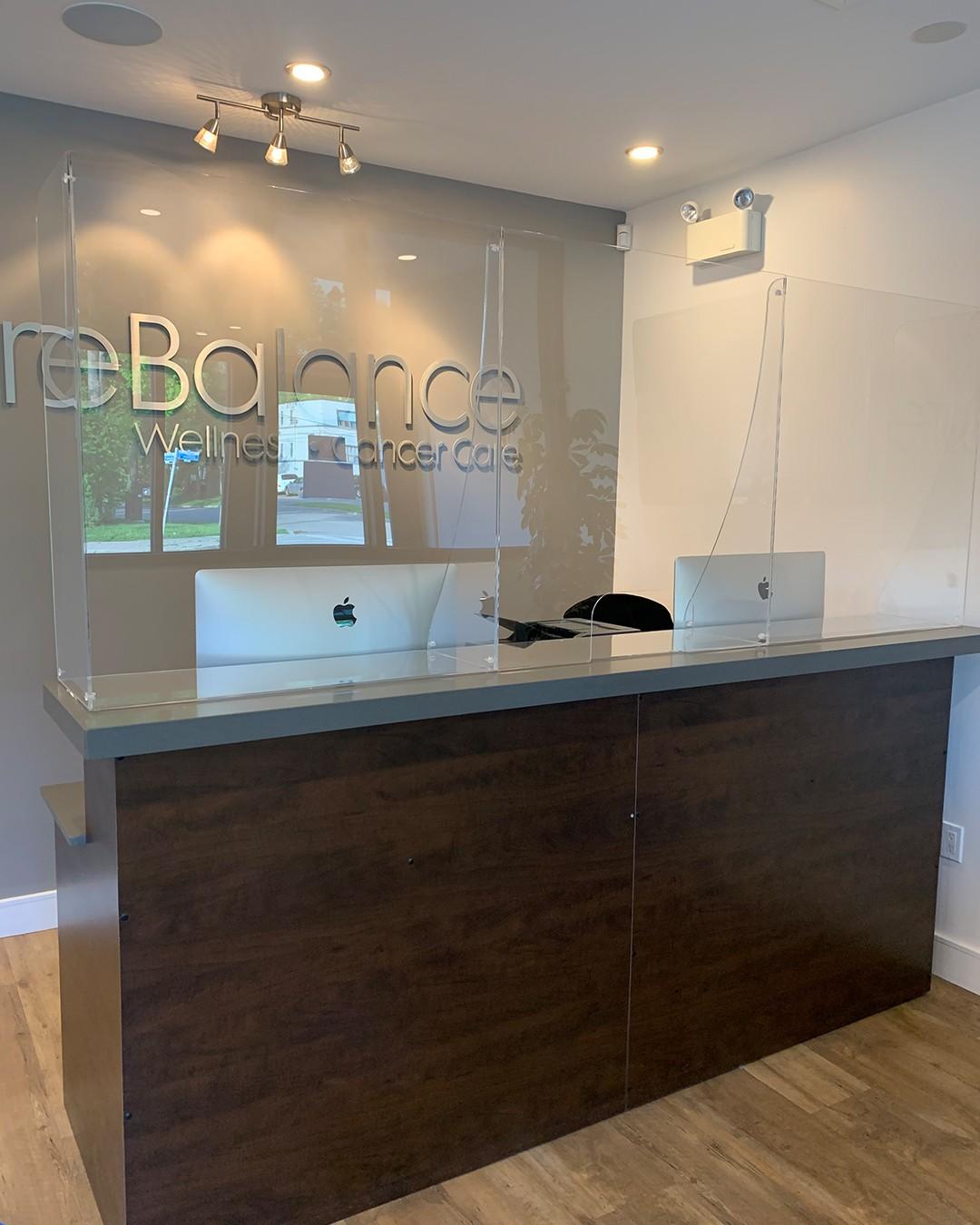 reception desk with sneeze guard