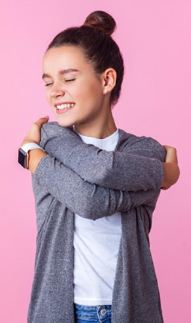 Girl Hugging Herself