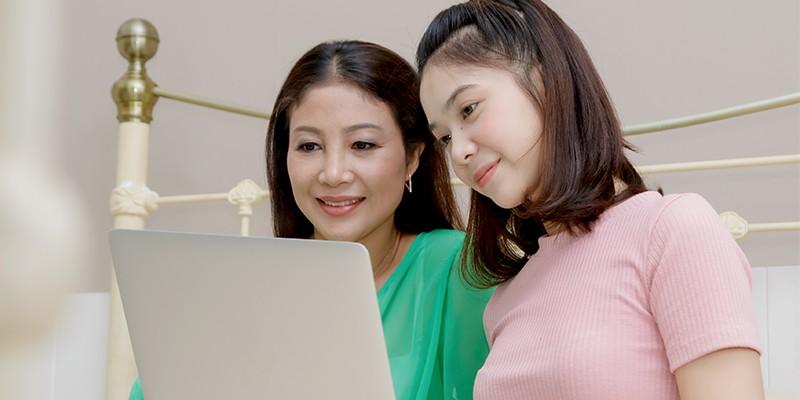 Mom & Daughter Looking at Laptop