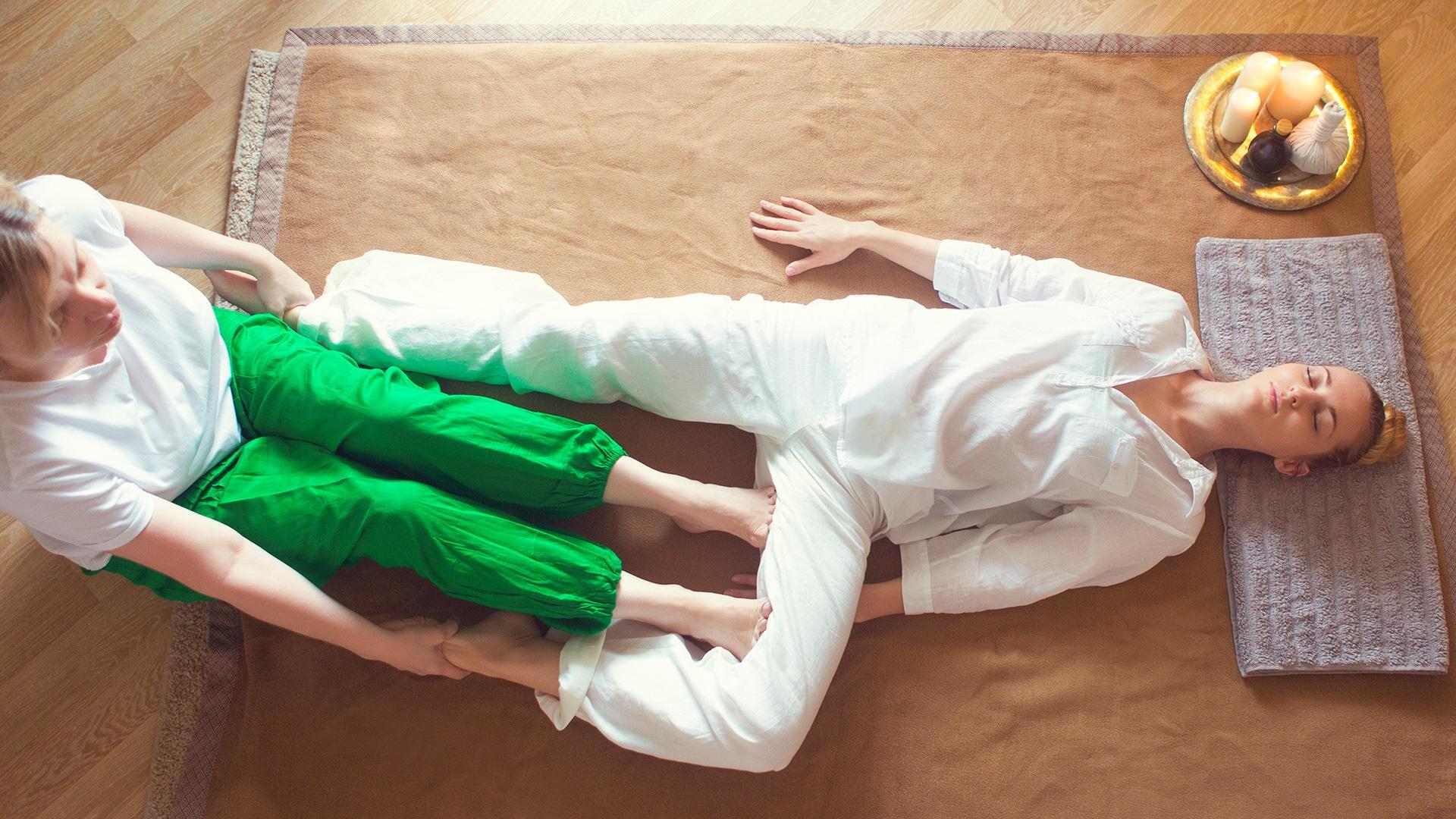 woman receiving Thai Yoga Massage Therapy - Available at pureBalance Wellness in Mississauga