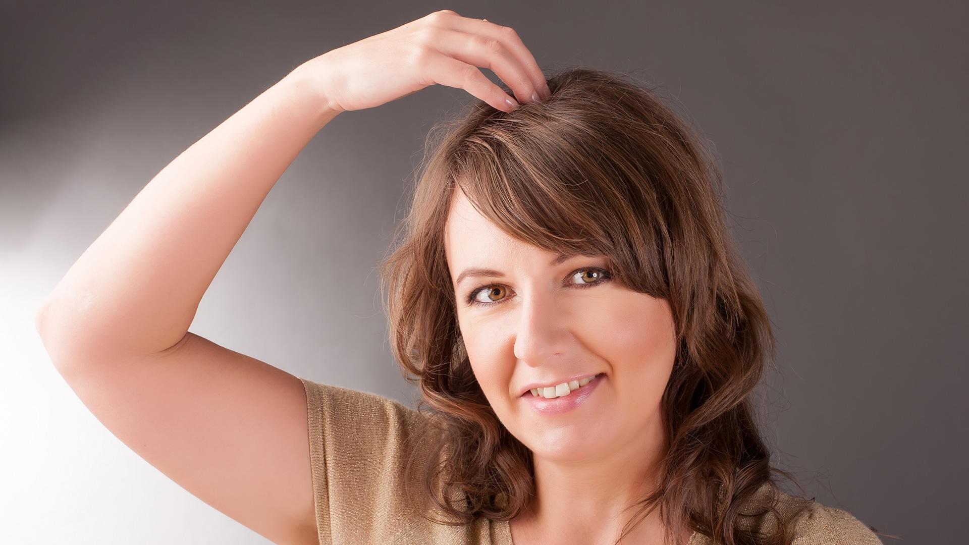 woman showing an EFT tapping spot - EFT or Emotional Freedom Techniques is available at pureBalance Wellness in Mississauga