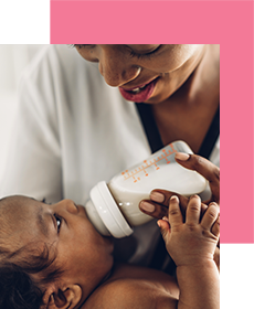 Mother bottle feeding baby