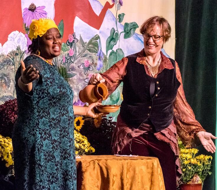 Phyllis and Corinna pouring water into a bowl at Opening Ceremony of the Southeast Wise Women Herbal Conference