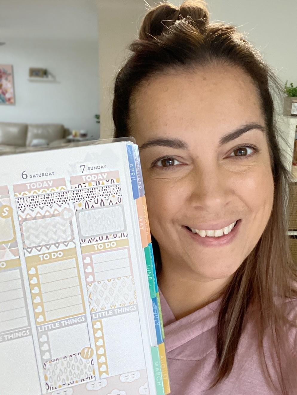 Woman holding planner
