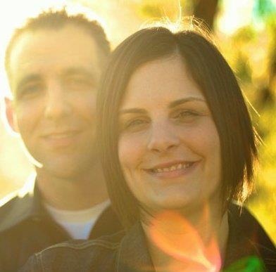 husband and wife standing in the sun