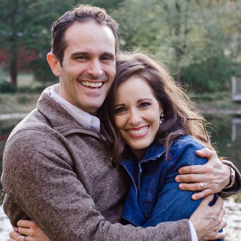 man and woman hugging near trees