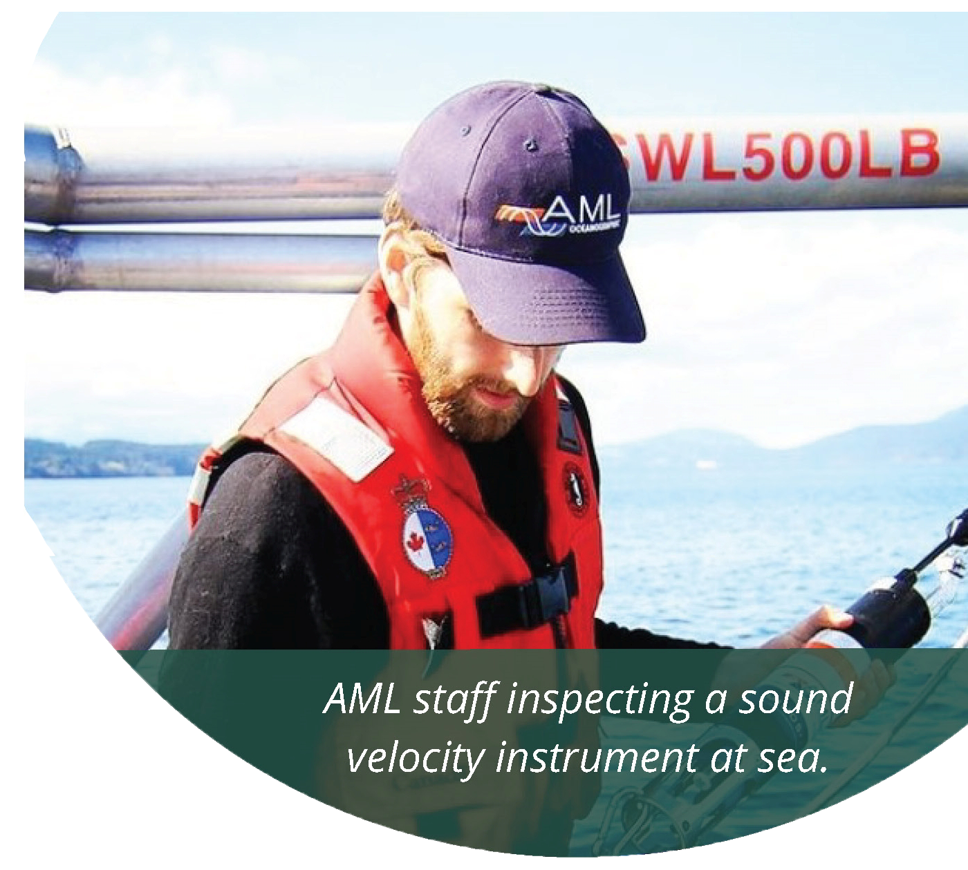 AML staff inspecting a sound velocity instrument at sea. Photo courtesy AML Oceanographic