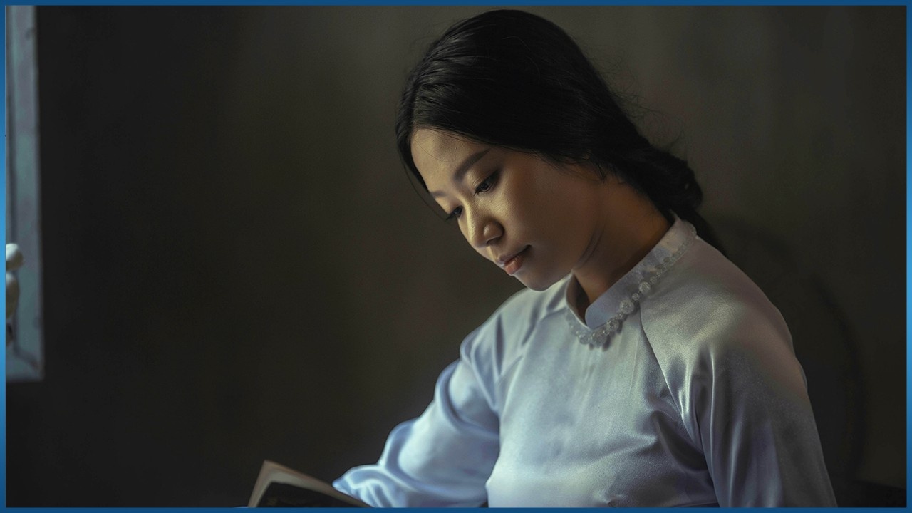 Asian woman reading a book